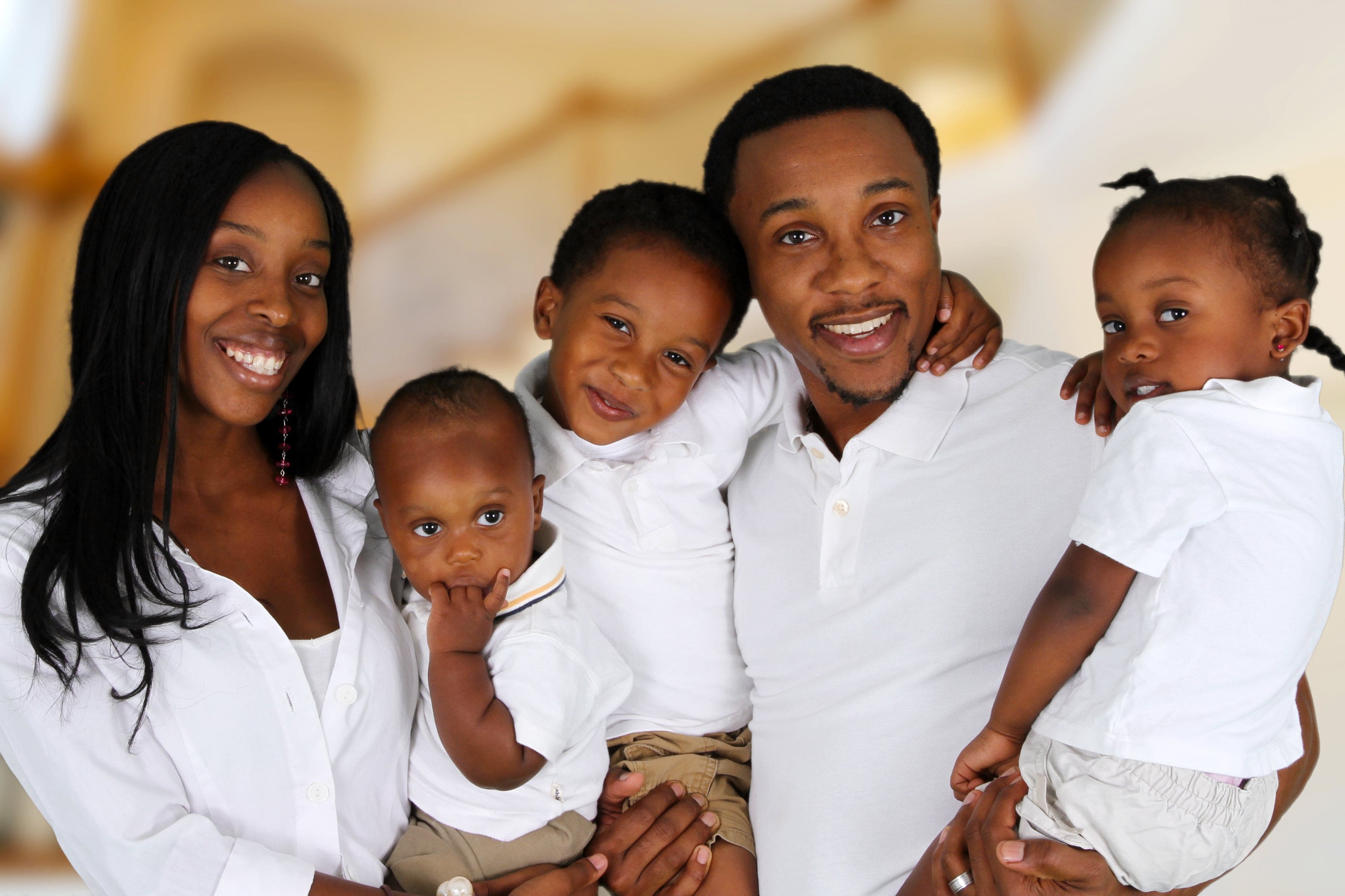 African American family together inside their home